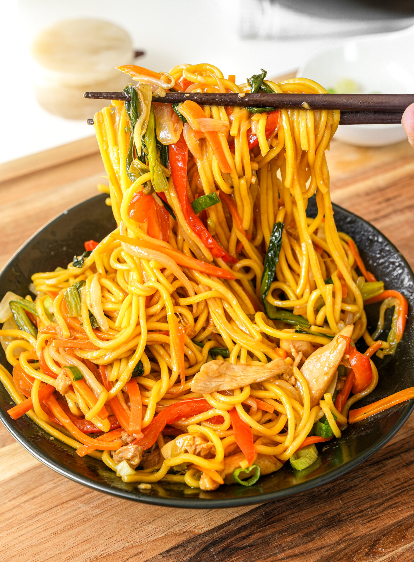Chicken Chowmein — yellow noodles lifted with chicken and peppers