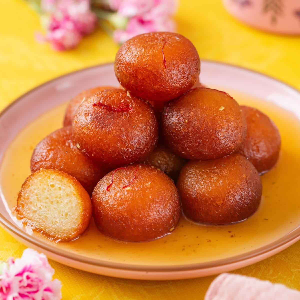 Gulab Jamun — soft dumplings in sugar syrup